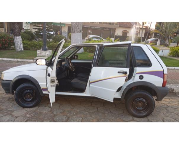 Foto de AUTOMOVEL FIAT/UNO MILLE WAY ECON, ALCOOL/GASOLINA, BRANCA, 2013/2013, CHASSI: 9BD15844AD6860476, RENAVAM: 00558896936, NO ESTADO EM QUE SE ENCONTRA.