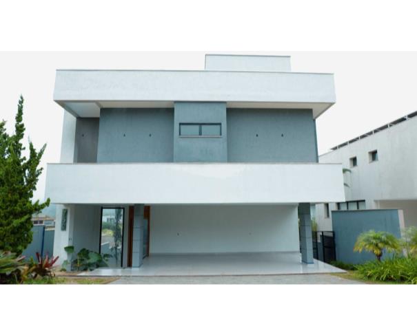 Foto de Residência de alto luxo no Condomínio Costa Laguna, em Nova Lima/MG, com 483 m², 4 dormitórios (3 suítes), piscina aquecida, espaço gourmet, cinema, automação residencial e 5 vagas cobertas. Condomínio com lazer completo e segurança 24 horas.