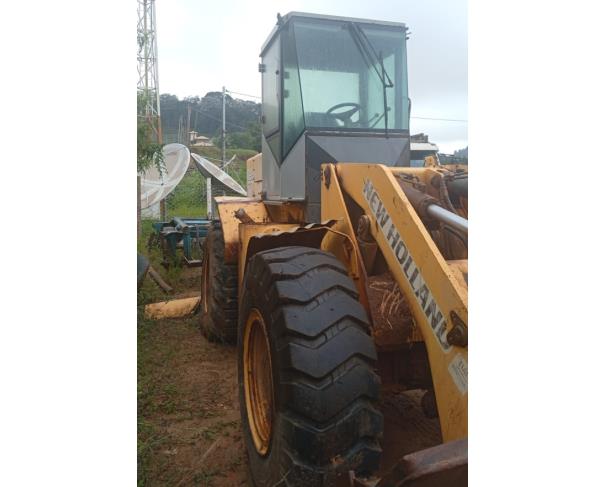 Foto de PÁ CARREGADEIRA NEW HOLLAND 12C, AMARELA, ANO: 2011, SÉRIE: NBAE00879, CHASSI: HBZN012CKBAE00879, NO ESTADO EM QUE SE ENCONTRA. 